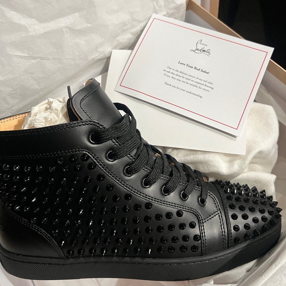 Christian Louboutin Black Signature on Document